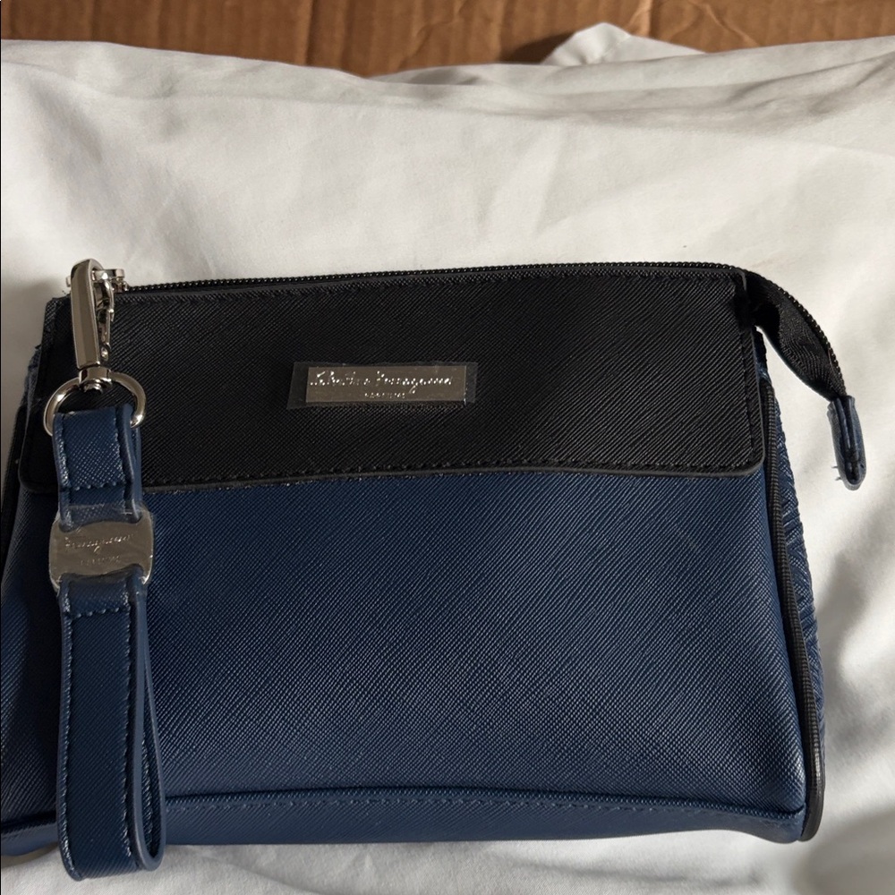 Salvatore Ferragamo Black and Blue cosmetics Bag with Wristlet handle.